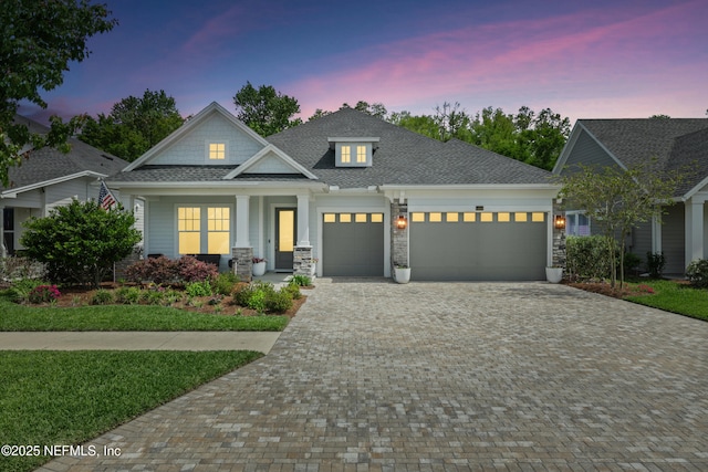 489 Windley Dr, Saint Augustine, FL 32092 - view of front of property with driveway, stone siding, a garage, and roof with shingles