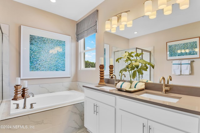 full bath featuring a bath, a sink, double vanity, and a stall shower