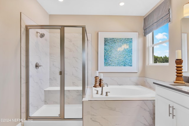 full bathroom featuring a bath, a marble finish shower, recessed lighting, and vanity