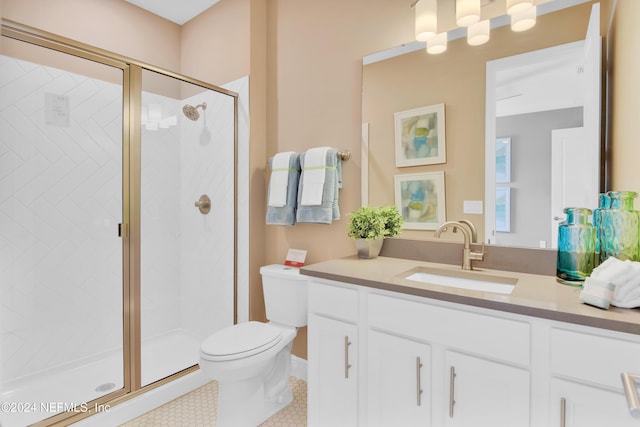 full bathroom featuring a shower stall, toilet, vanity, and tile patterned floors