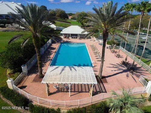 pool with fence and a gazebo