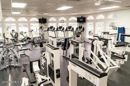 exercise room featuring a drop ceiling