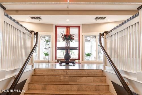 stairs featuring visible vents and recessed lighting
