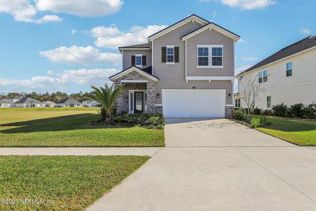 29 Stargaze Ln, Saint Augustine, FL 32095 - view of front of property featuring stone siding, a garage, a front lawn, and concrete driveway