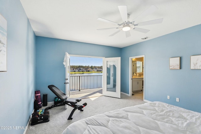 29 Stargaze Ln, Saint Augustine, FL 32095 - bedroom with carpet floors, baseboards, access to outside, ceiling fan, and a water view