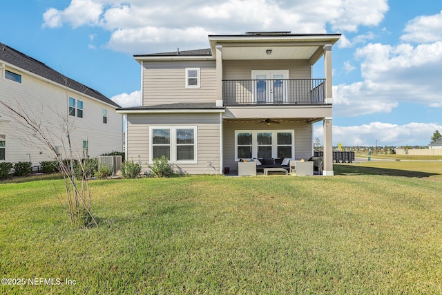 29 Stargaze Ln, Saint Augustine, FL 32095 - rear view of house featuring a balcony, an outdoor living space, ceiling fan, and a lawn