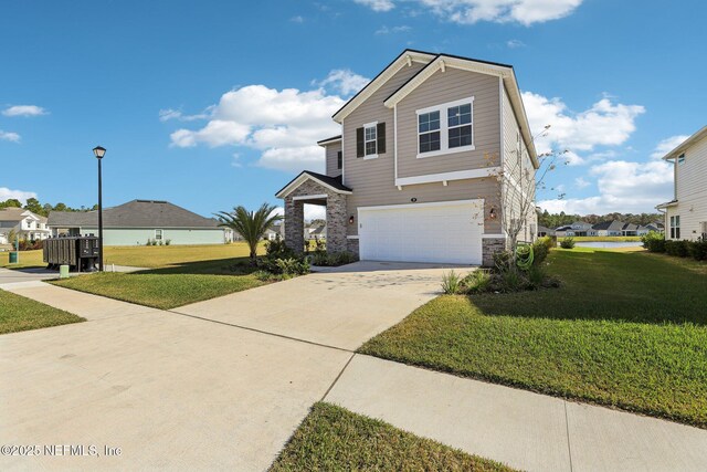 29 Stargaze Ln, Saint Augustine, FL 32095 - view of front of house featuring stone siding, a garage, driveway, and a front yard