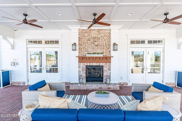 29 Stargaze Ln, Saint Augustine, FL 32095 - living room featuring french doors, a ceiling fan, brick floors, coffered ceiling, and wooden walls