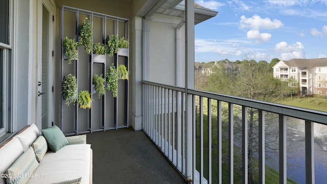 balcony featuring an outdoor hangout area and a residential view