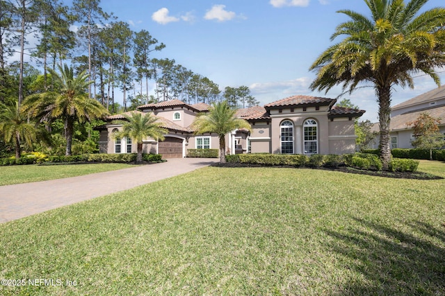 464 Deer Valley Dr, Ponte Vedra, FL 32081 - mediterranean / spanish house featuring a front lawn, a tile roof, stucco siding, and driveway