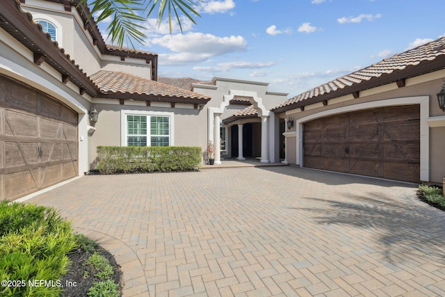 464 Deer Valley Dr, Ponte Vedra, FL 32081 - exterior space with a tiled roof, a garage, decorative driveway, and stucco siding