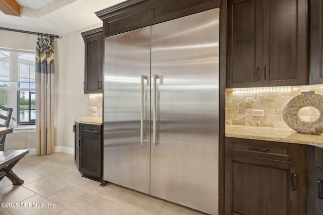 464 Deer Valley Dr, Ponte Vedra, FL 32081 - kitchen featuring dark brown cabinets, stainless steel built in refrigerator, and tasteful backsplash