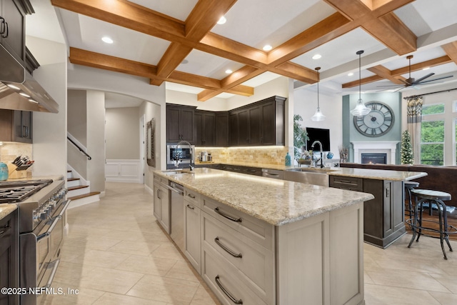 464 Deer Valley Dr, Ponte Vedra, FL 32081 - kitchen with stainless steel appliances, decorative backsplash, a sink, arched walkways, and a ceiling fan