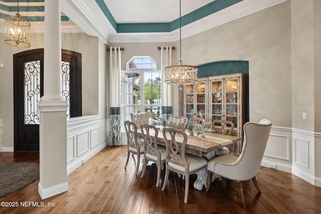 464 Deer Valley Dr, Ponte Vedra, FL 32081 - dining room featuring a wainscoted wall, a raised ceiling, wood finished floors, a decorative wall, and an inviting chandelier