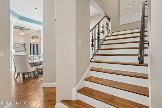 464 Deer Valley Dr, Ponte Vedra, FL 32081 - stairway featuring baseboards, a notable chandelier, crown molding, and hardwood / wood-style floors