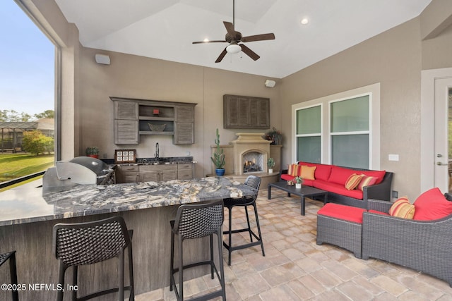 464 Deer Valley Dr, Ponte Vedra, FL 32081 - view of patio featuring a sink, an outdoor living space with a fireplace, exterior kitchen, and a ceiling fan
