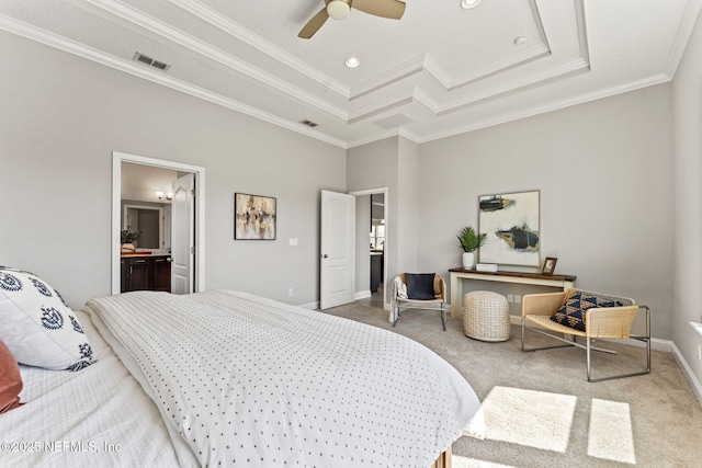 bedroom with light colored carpet, crown molding, visible vents, and a raised ceiling