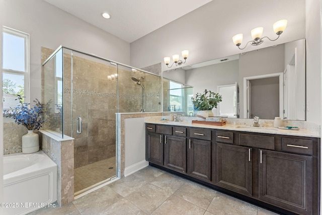 bathroom with a bath, a shower stall, a healthy amount of sunlight, and a sink
