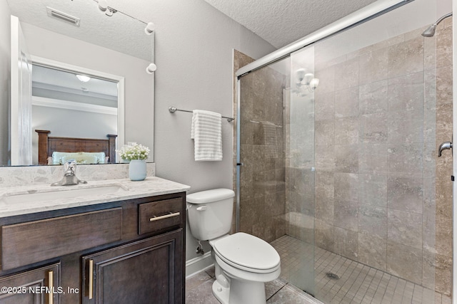 full bathroom featuring a textured ceiling, toilet, visible vents, a shower stall, and vanity