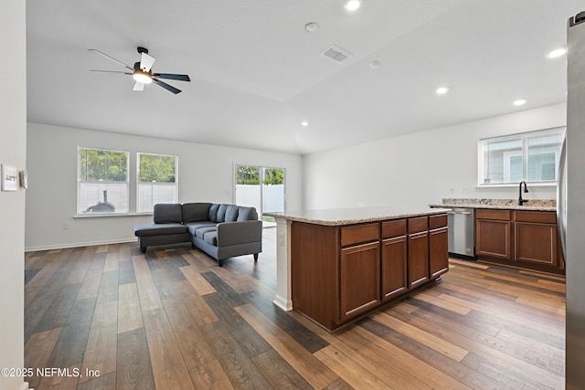 6387 Barrington Cv Ln, Jacksonville, FL 32218 - kitchen featuring dishwasher, dark wood-style floors, ceiling fan, recessed lighting, and a center island