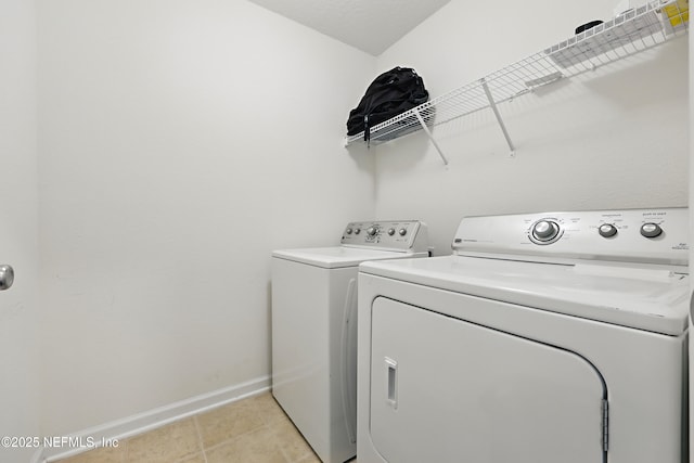 6387 Barrington Cv Ln, Jacksonville, FL 32218 - laundry room featuring washer and dryer and baseboards