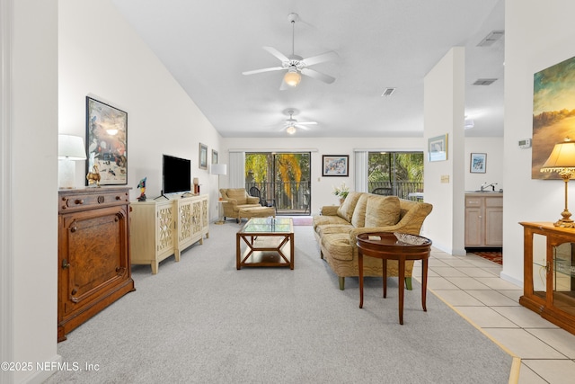 38 Talavera Ct, Saint Augustine, FL 32086 - living room featuring light carpet, visible vents, ceiling fan, and light tile patterned floors