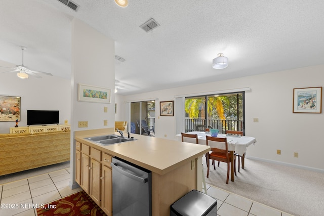 38 Talavera Ct, Saint Augustine, FL 32086 - kitchen with visible vents, a sink, open floor plan, stainless steel dishwasher, and light carpet