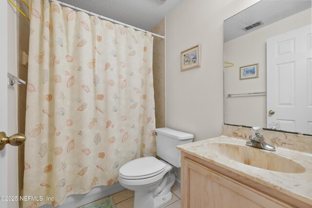 38 Talavera Ct, Saint Augustine, FL 32086 - bathroom featuring vanity, tile patterned flooring, a textured ceiling, toilet, and visible vents