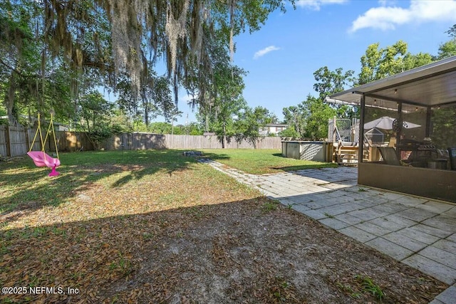 10630 Dodd Rd, Jacksonville, FL 32218 - view of yard with a patio area, a fenced backyard, and a sunroom