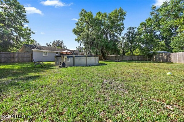 10630 Dodd Rd, Jacksonville, FL 32218 - view of yard with a fenced backyard and a fenced in pool