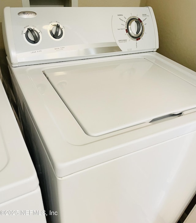 8290 Gate Pkwy W Unit 504, Jacksonville, FL 32216 - laundry room with washer / clothes dryer and laundry area