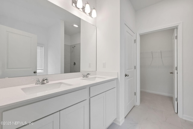 356 Salazar St, Saint Augustine, FL 32095 - full bath featuring marble finish floors, a shower, double vanity, and a walk in closet