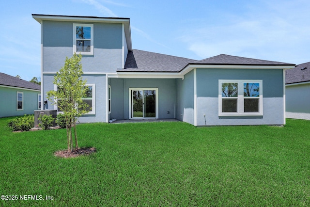 356 Salazar St, Saint Augustine, FL 32095 - rear view of house with a yard, stucco siding, and roof with shingles
