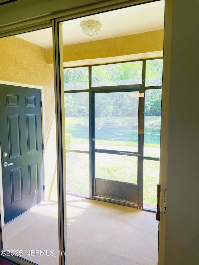 8539 Gate Pkwy W Unit 1616, Jacksonville, FL 32216 - interior space featuring plenty of natural light and a textured wall