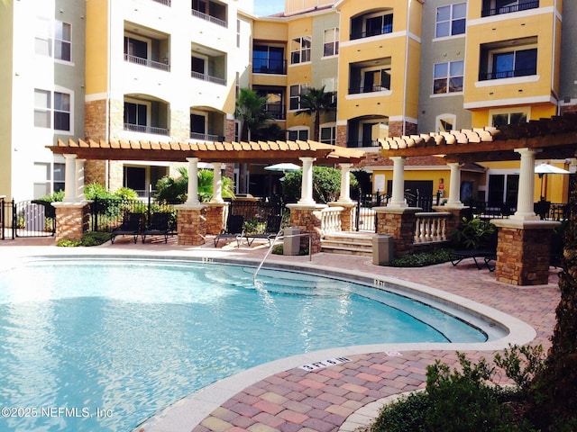8539 Gate Pkwy W Unit 1616, Jacksonville, FL 32216 - view of pool with a patio, fence, and a pergola