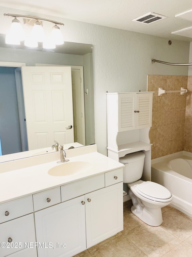 8539 Gate Pkwy W Unit 1616, Jacksonville, FL 32216 - bathroom with tile patterned flooring, vanity, toilet, visible vents, and washtub / shower combination