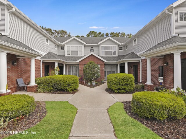 35211 Harbour Vista Cir, Saint Augustine, FL 32080 - exterior space featuring roof with shingles and brick siding