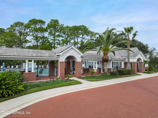 35211 Harbour Vista Cir, Saint Augustine, FL 32080 - ranch-style home featuring brick siding, a tiled roof, and fence