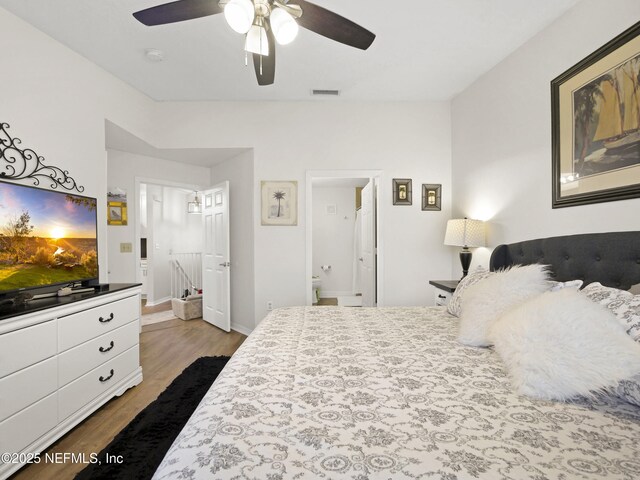 35211 Harbour Vista Cir, Saint Augustine, FL 32080 - bedroom with visible vents, baseboards, ensuite bathroom, a ceiling fan, and wood finished floors