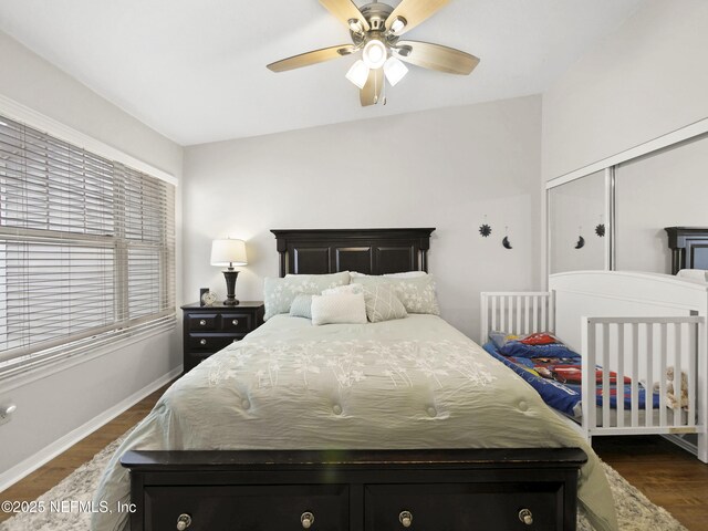 35211 Harbour Vista Cir, Saint Augustine, FL 32080 - bedroom featuring dark wood-style flooring, baseboards, and a ceiling fan