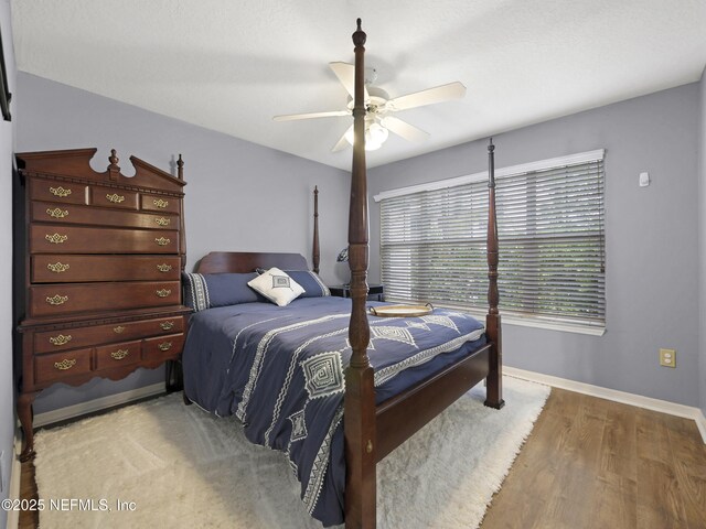 35211 Harbour Vista Cir, Saint Augustine, FL 32080 - bedroom featuring wood finished floors, ceiling fan, and baseboards