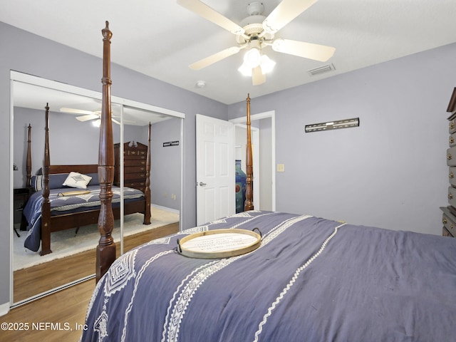 35211 Harbour Vista Cir, Saint Augustine, FL 32080 - bedroom with visible vents, a ceiling fan, a closet, and wood finished floors