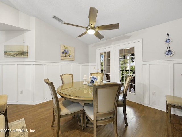 35211 Harbour Vista Cir, Saint Augustine, FL 32080 - dining space featuring a decorative wall, a ceiling fan, visible vents, wood finished floors, and wainscoting