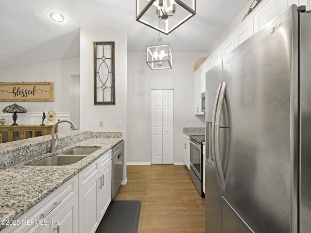 35211 Harbour Vista Cir, Saint Augustine, FL 32080 - kitchen featuring a sink, white cabinets, appliances with stainless steel finishes, and dark wood-type flooring