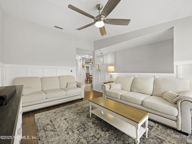 35211 Harbour Vista Cir, Saint Augustine, FL 32080 - living room featuring visible vents, a decorative wall, a ceiling fan, wainscoting, and wood finished floors