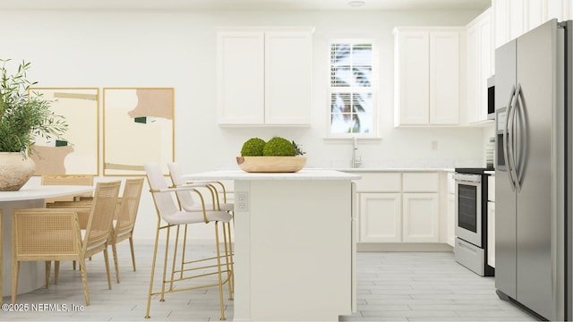 99 Hogan Ct, Saint Augustine, FL 32092 - kitchen featuring light countertops, a kitchen breakfast bar, stainless steel fridge, range with electric stovetop, and white cabinets