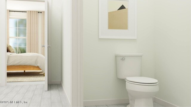 99 Hogan Ct, Saint Augustine, FL 32092 - bathroom with baseboards, connected bathroom, and toilet
