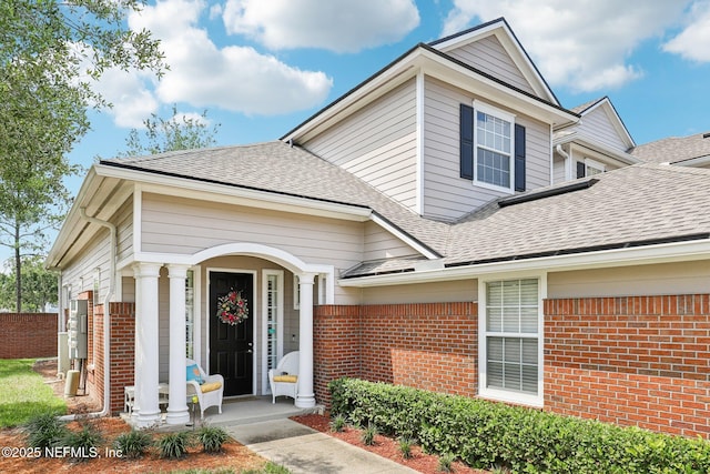 2011 Pond Ridge Ct Unit 1201, Fleming Island, FL 32003 - view of front of house featuring brick siding and roof with shingles