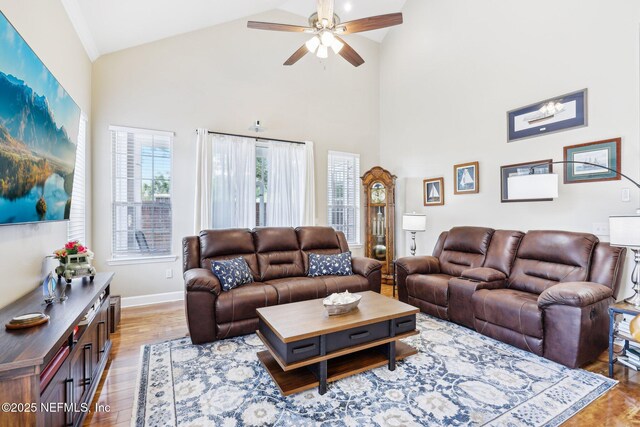 2011 Pond Ridge Ct Unit 1201, Fleming Island, FL 32003 - living area featuring a ceiling fan, wood finished floors, high vaulted ceiling, and baseboards
