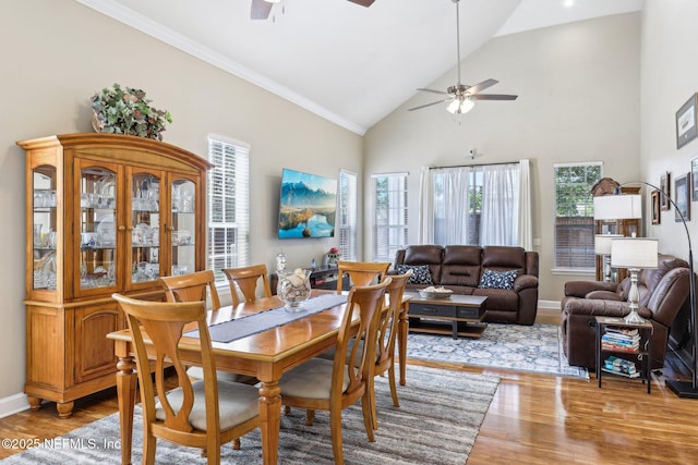 2011 Pond Ridge Ct Unit 1201, Fleming Island, FL 32003 - dining area with ceiling fan, healthy amount of natural light, light wood-style flooring, crown molding, and high vaulted ceiling